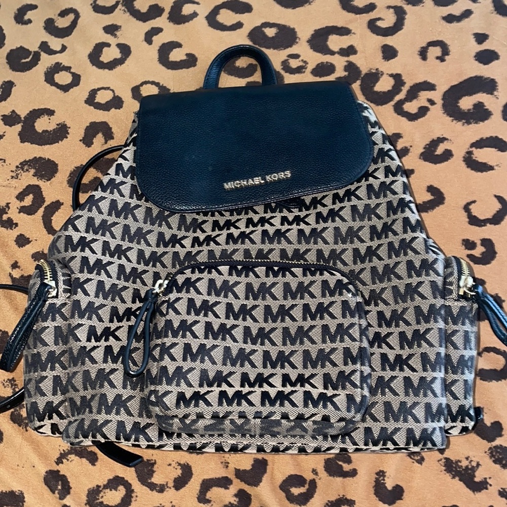 Black and tan MK backpack.